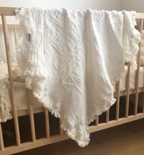 Cream swaddle with cream fringe